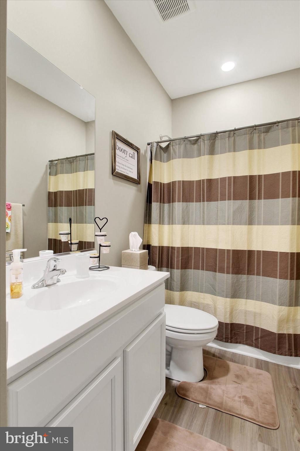626 Ledger Drive Hanover, PA 17331 - Photo 16 of 37 a bathroom with a sink a toilet a mirror and shower