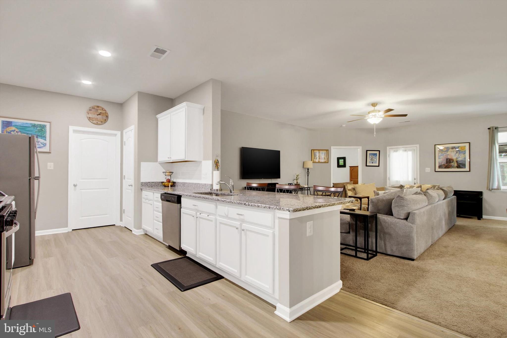 626 Ledger Drive Hanover, PA 17331 - Photo 5 of 37 a view of living room kitchen with stainless steel appliances kitchen island