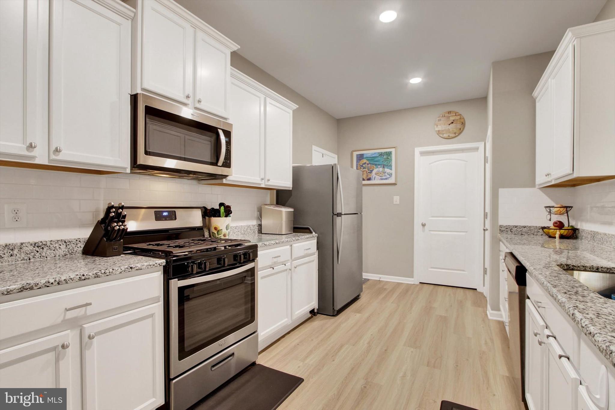 626 Ledger Drive Hanover, PA 17331 - Photo 6 of 37 a kitchen with stainless steel appliances granite countertop a stove a sink and a refrigerator