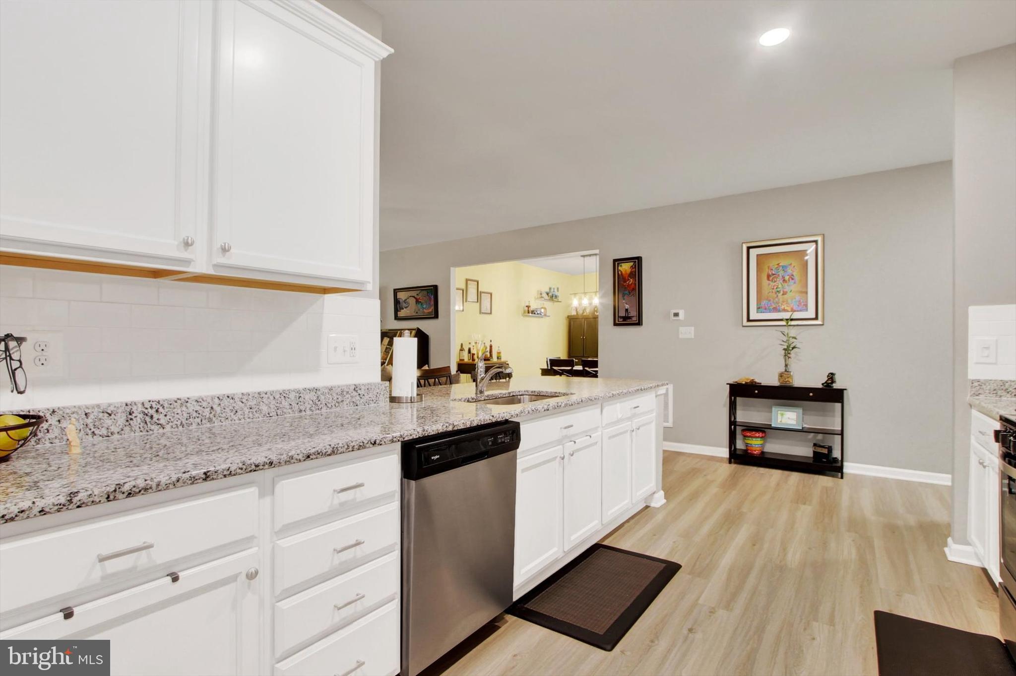 626 Ledger Drive Hanover, PA 17331 - Photo 8 of 37 a kitchen with granite countertop white cabinets and white appliances
