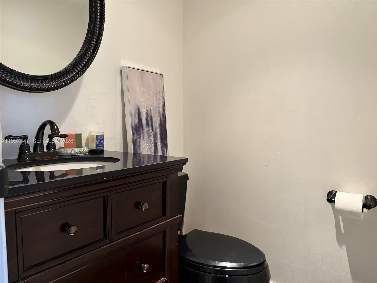 6600 Cypress Road, Unit 203 Plantation, FL 33317 - Photo 5 of 12 a bathroom with a toilet and a sink