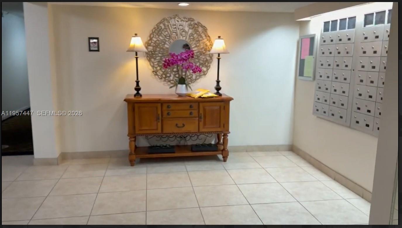 6600 Cypress Road, Unit 203 Plantation, FL 33317 - Photo 8 of 12 a room with painting and a table