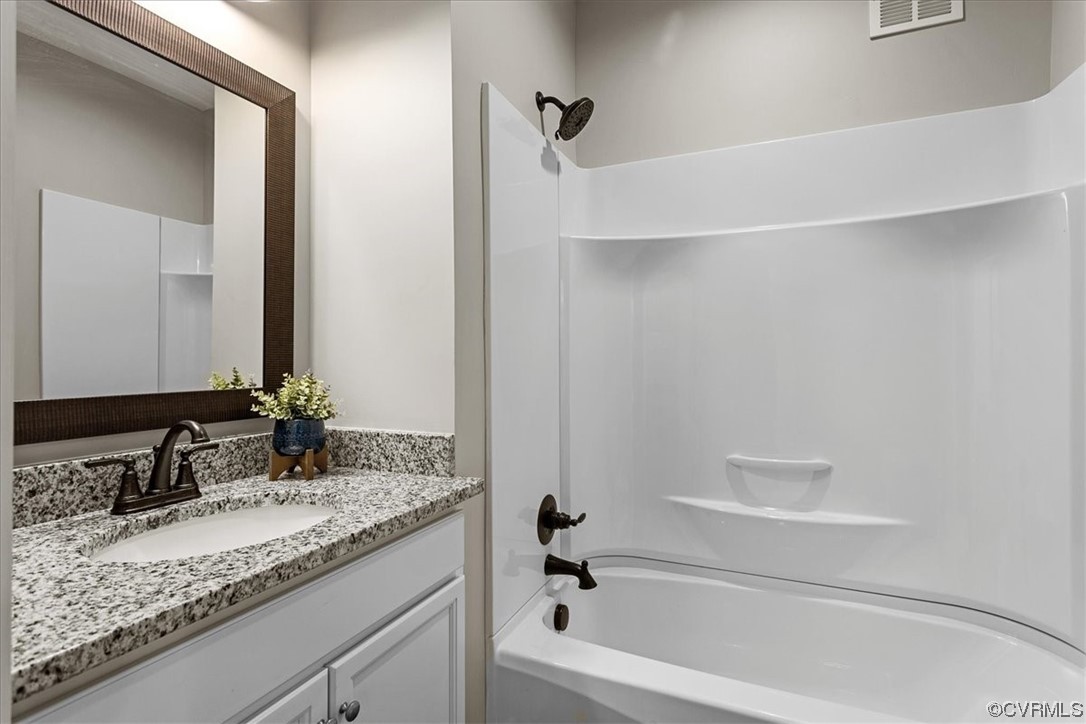 6704 Courthouse Road Church Road, VA 23833 - Photo 11 of 27 a bathroom with a granite countertop sink and a mirror