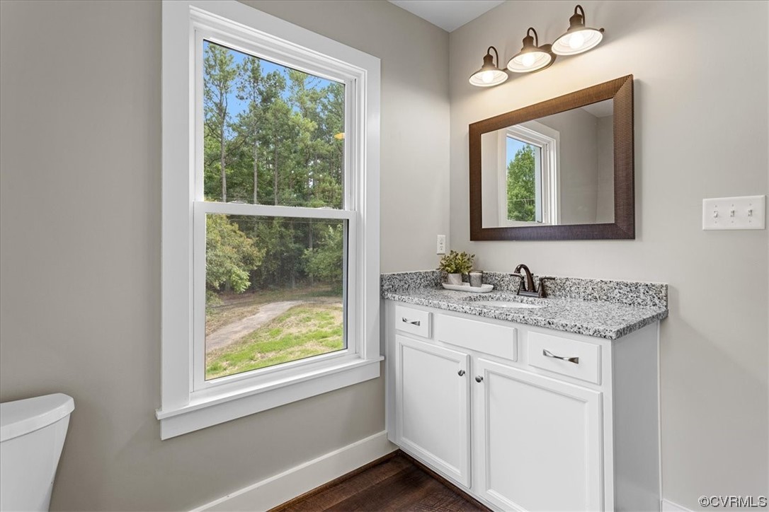 6704 Courthouse Road Church Road, VA 23833 - Photo 17 of 27 a bathroom with a granite countertop sink mirror and a window