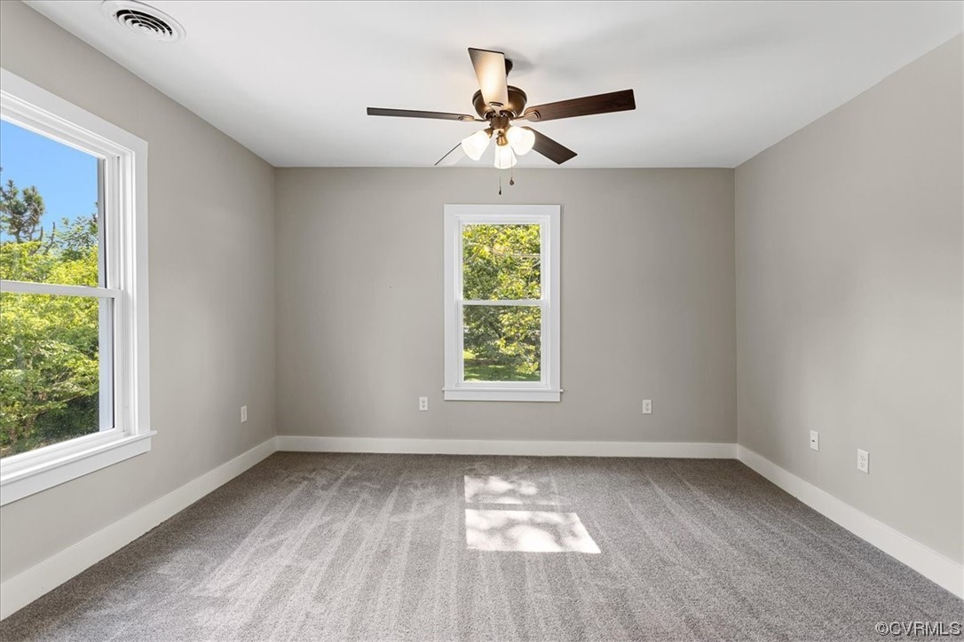 6704 Courthouse Road Church Road, VA 23833 - Photo 19 of 27 an empty room with a window and a fan