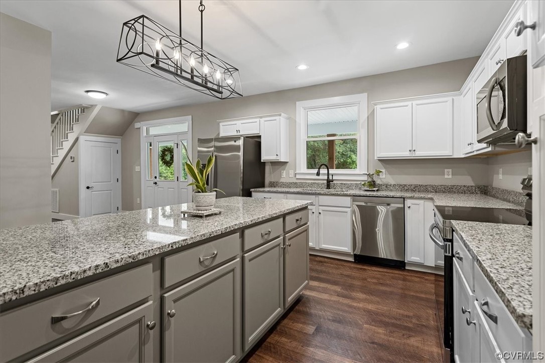 6704 Courthouse Road Church Road, VA 23833 - Photo 5 of 27 a kitchen with stainless steel appliances granite countertop a sink a stove top oven a counter space and cabinets