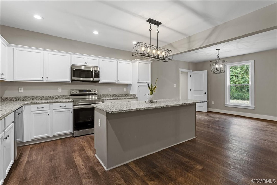 6704 Courthouse Road Church Road, VA 23833 - Photo 7 of 27 a kitchen with stainless steel appliances a stove sink and microwave