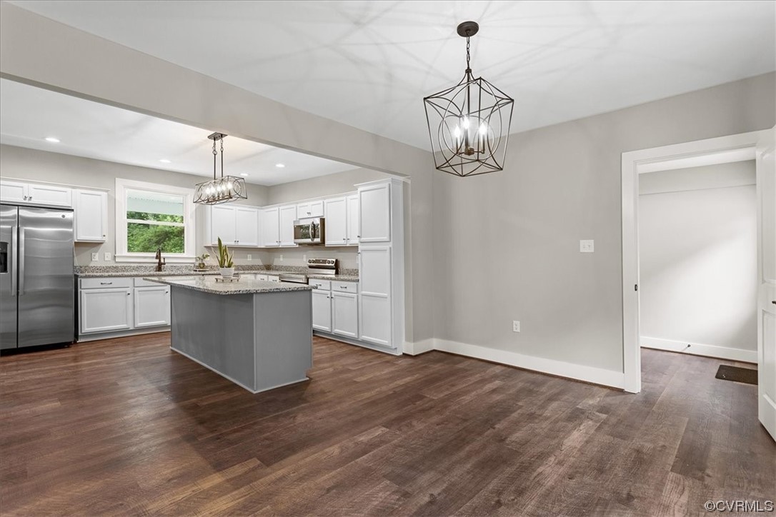 6704 Courthouse Road Church Road, VA 23833 - Photo 8 of 27 a view of a kitchen with a sink stainless steel appliances and cabinets