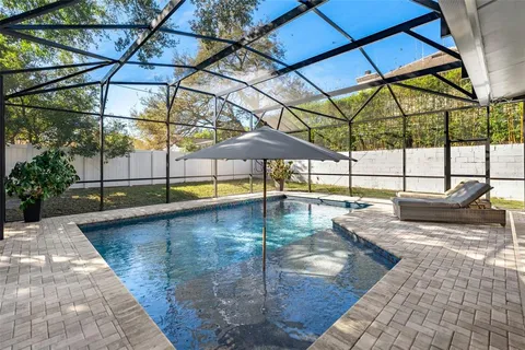 a view of a swimming pool with a lounge chairs