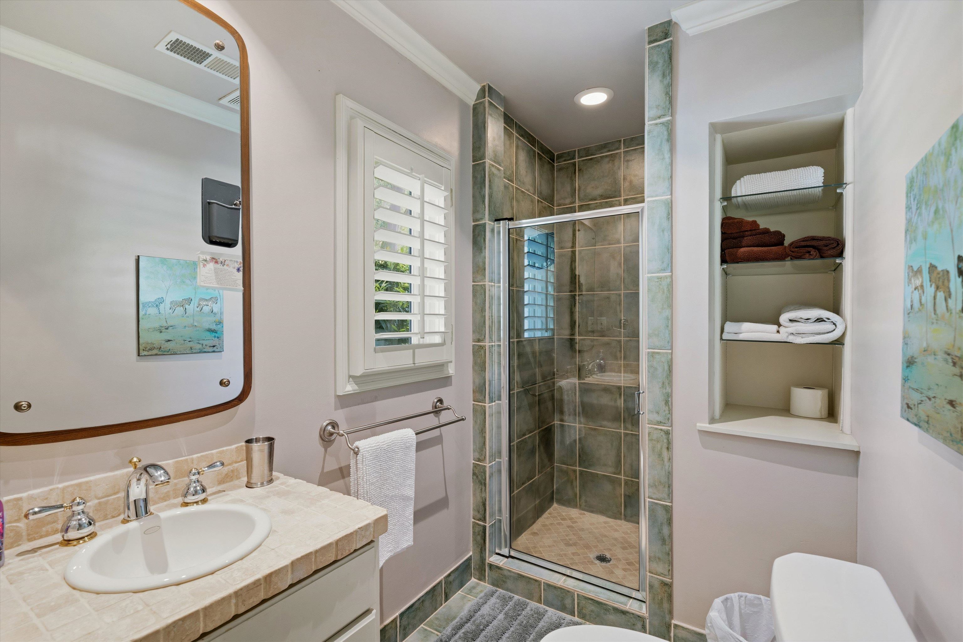 4710 Gwynne Road Memphis, TN 38117 - Photo 24 of 40 a bathroom with a shower sink and mirror