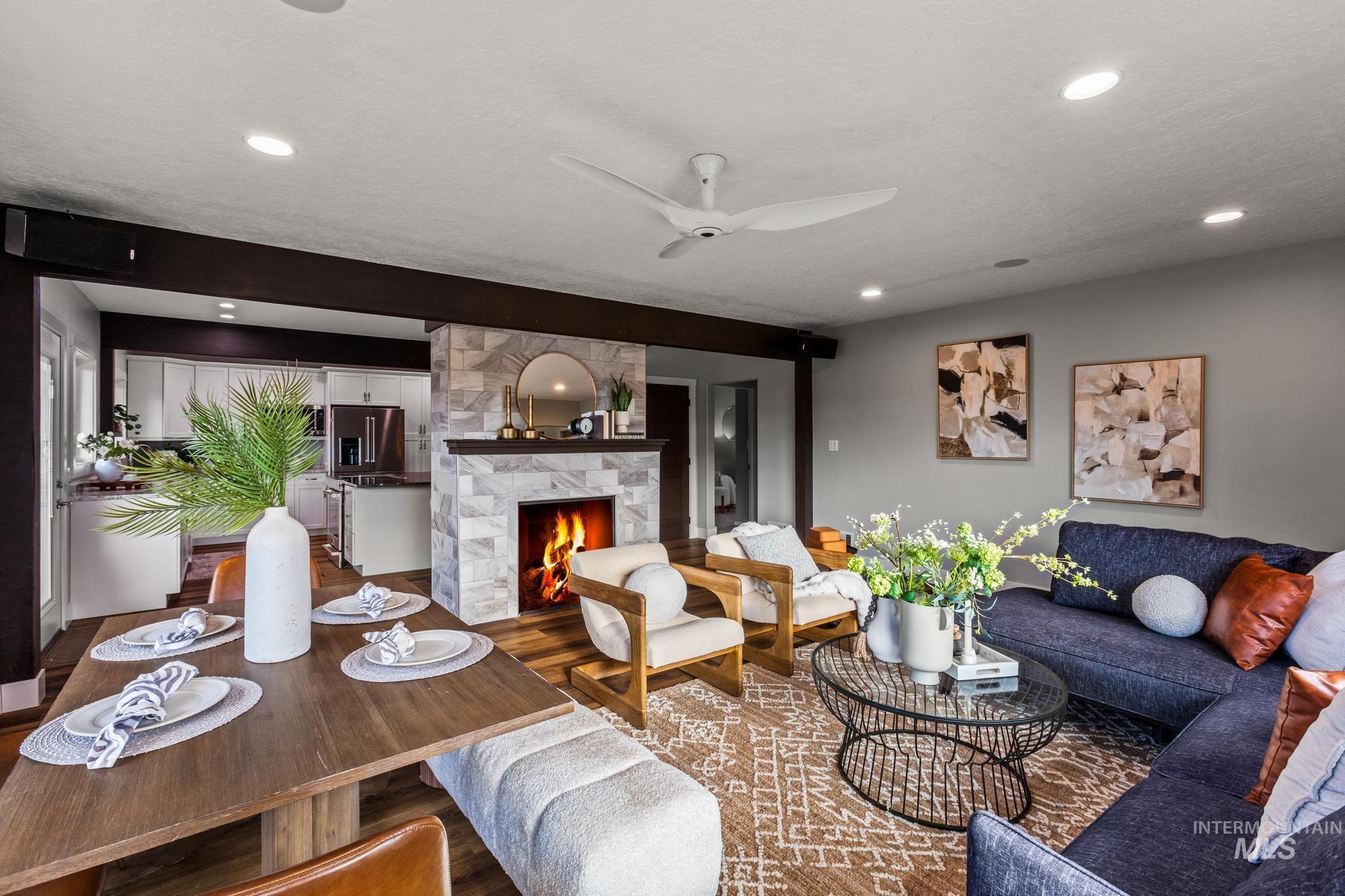 300 West Ofarrell Street Boise, ID 83702 - Photo 14 of 50 Living room featuring wood finished floors, a ceiling fan, a stone fireplace, and recessed lighting