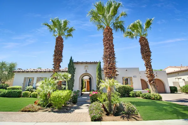 a view of a garden with a fountain