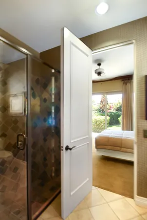 a bathroom with a glass shower door