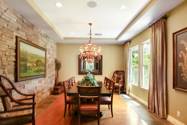 a view of a dining room with furniture and window