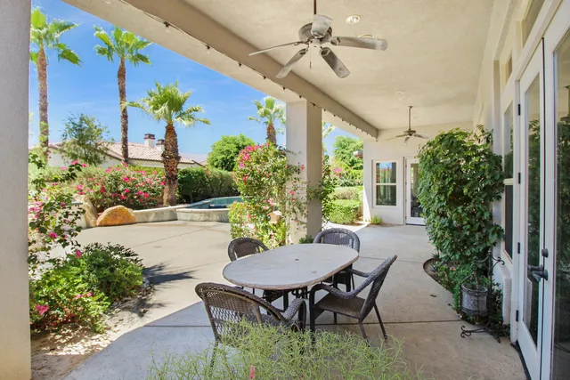 a view of a chairs and table in a patio