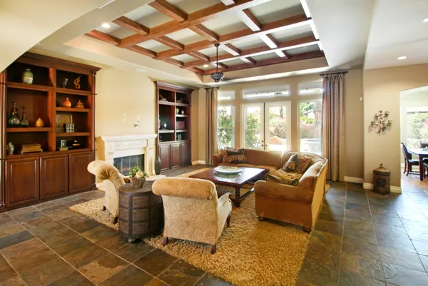 a dining room with furniture and a chandelier