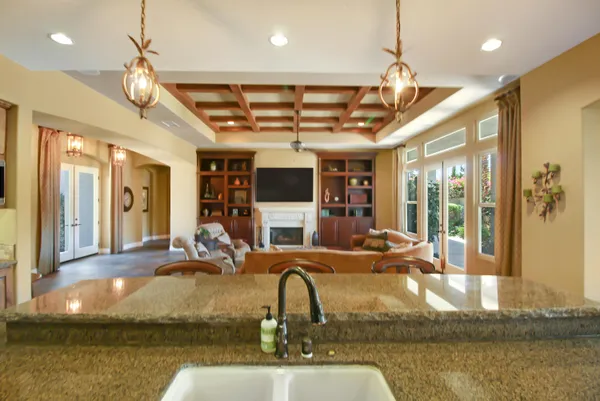 a room with lots of windows and couches