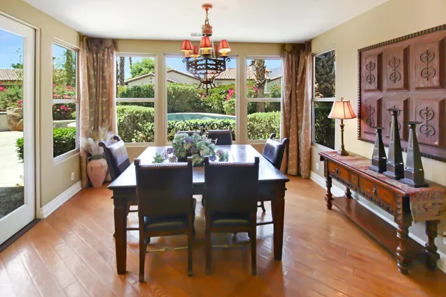 a view of a dining room with furniture window and wooden floor