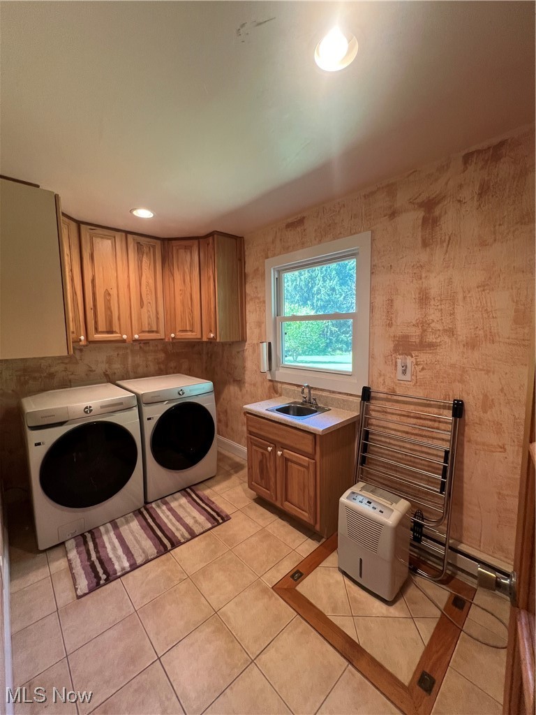 6171 Barrett Road Geneva, OH 44041 - Photo 36 of 38 Washroom with light tile patterned floors, cabinet space, washing machine and clothes dryer, recessed lighting, and wallpapered walls