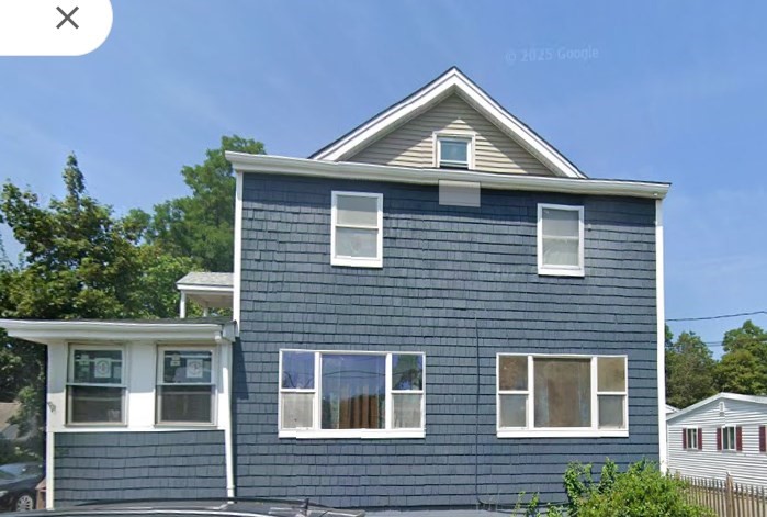 34 Garfield Street, Unit 2 Taunton, MA 02780 - Photo 1 of 10 a front view of a house with a yard