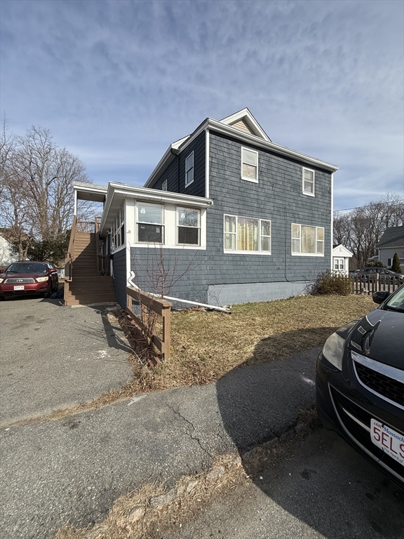 34 Garfield Street, Unit 2 Taunton, MA 02780 - Photo 2 of 10 a front view of a house with a yard