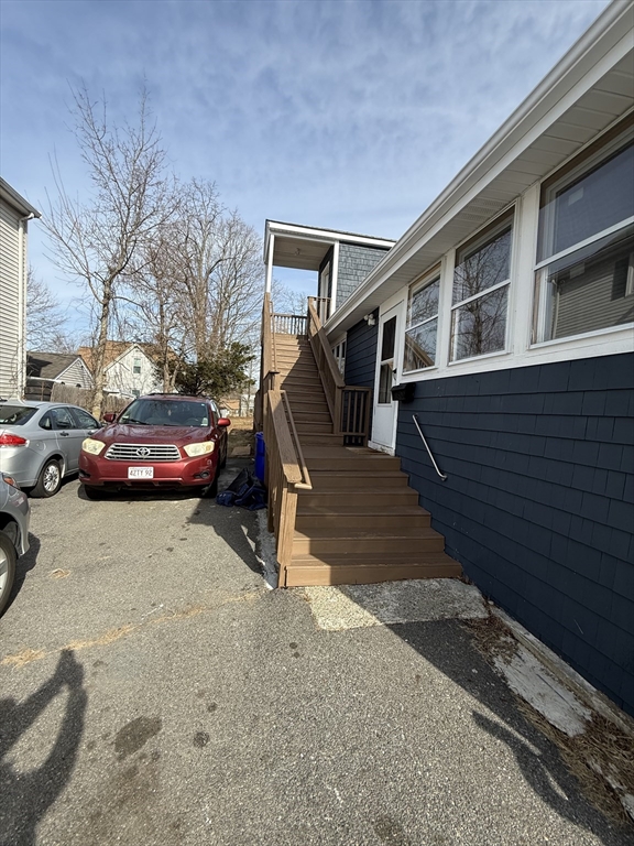 34 Garfield Street, Unit 2 Taunton, MA 02780 - Photo 3 of 10 a car parked in front of a house