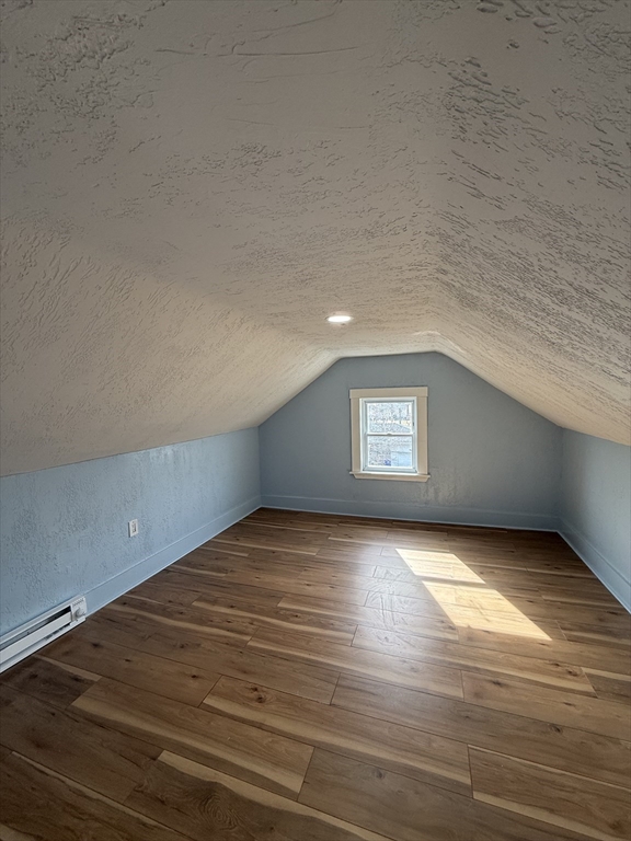 34 Garfield Street, Unit 2 Taunton, MA 02780 - Photo 4 of 10 a view of an empty room with window and wooden floor