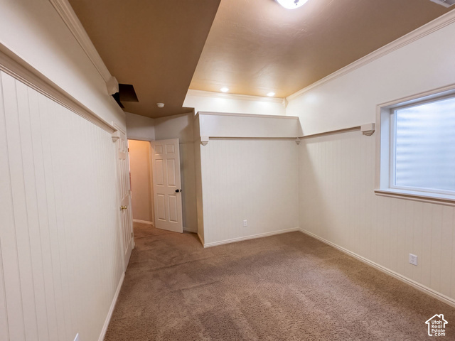 232 Bugle Way Providence, UT 84332 - Photo 28 of 36 Textured carpet flooring, window with frosted glass, crown molding, and wainscoting