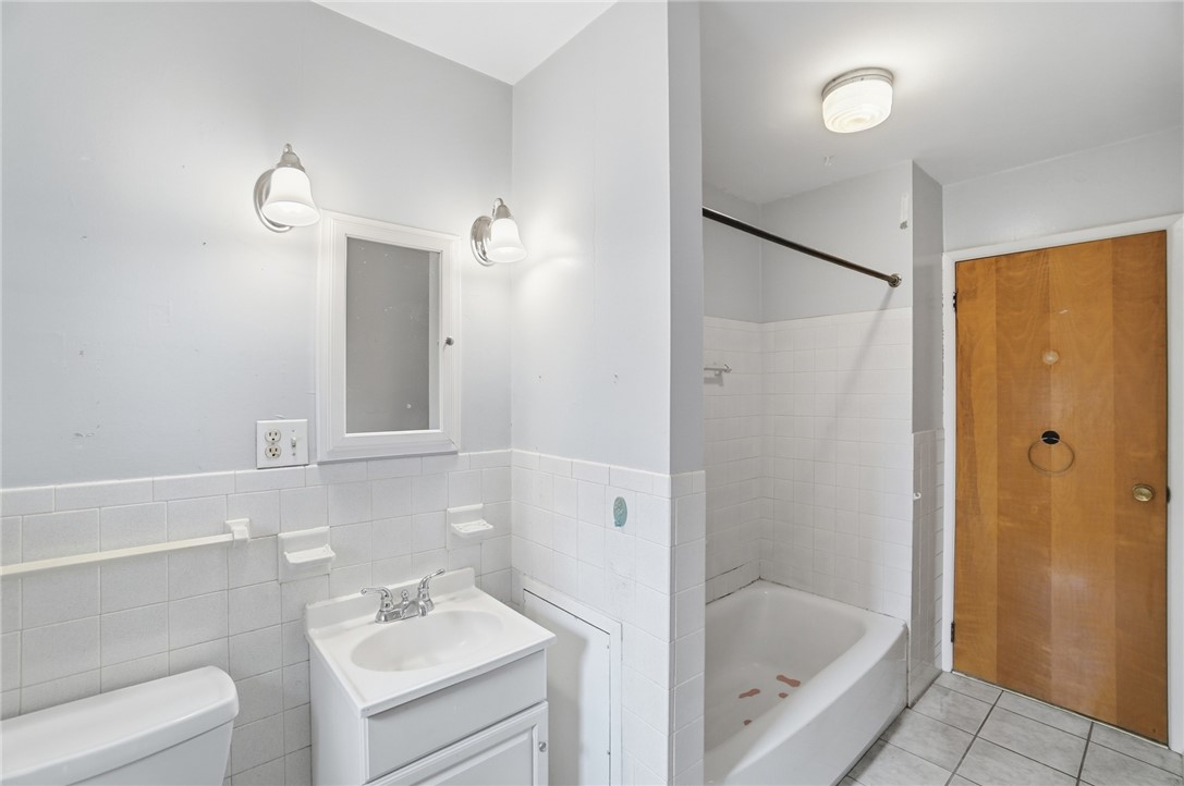 1087 Fairfield Road Troy, OH 45373 - Photo 19 of 39 This clean and functional bathroom offers a bright space for daily routines.