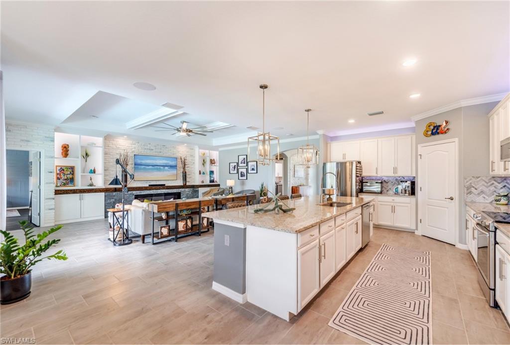 19812 Beechcrest Place Estero, FL 33928 - Photo 12 of 50 a large white kitchen with a large window