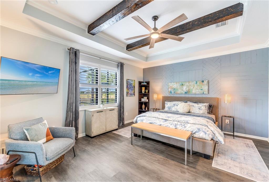 19812 Beechcrest Place Estero, FL 33928 - Photo 22 of 50 a bedroom with a bed and a couch