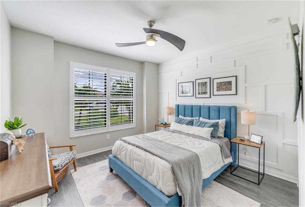 19812 Beechcrest Place Estero, FL 33928 - Photo 30 of 50 a bedroom with a bed and a table