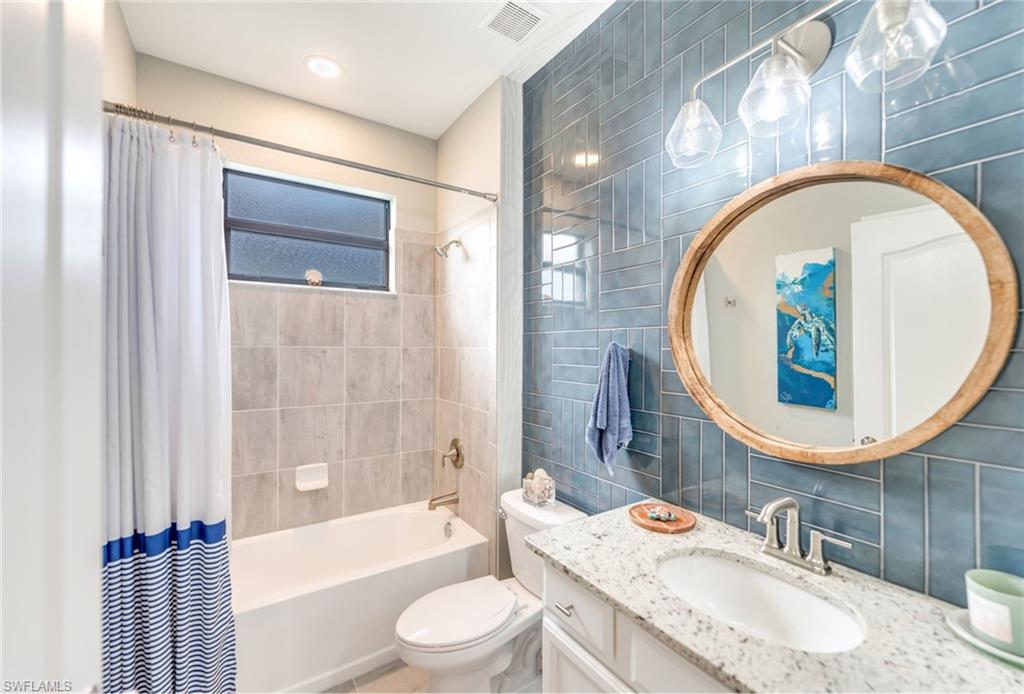 19812 Beechcrest Place Estero, FL 33928 - Photo 32 of 50 a bathroom with a sink and a mirror