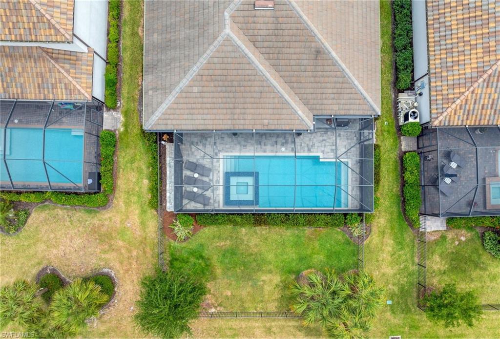 19812 Beechcrest Place Estero, FL 33928 - Photo 40 of 50 a front view of a house with garden