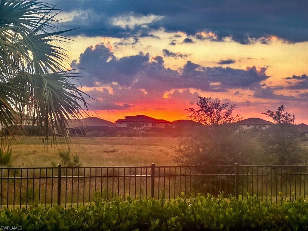 19812 Beechcrest Place Estero, FL 33928 - Photo 4 of 50 a view of a lake with a mountain in the background