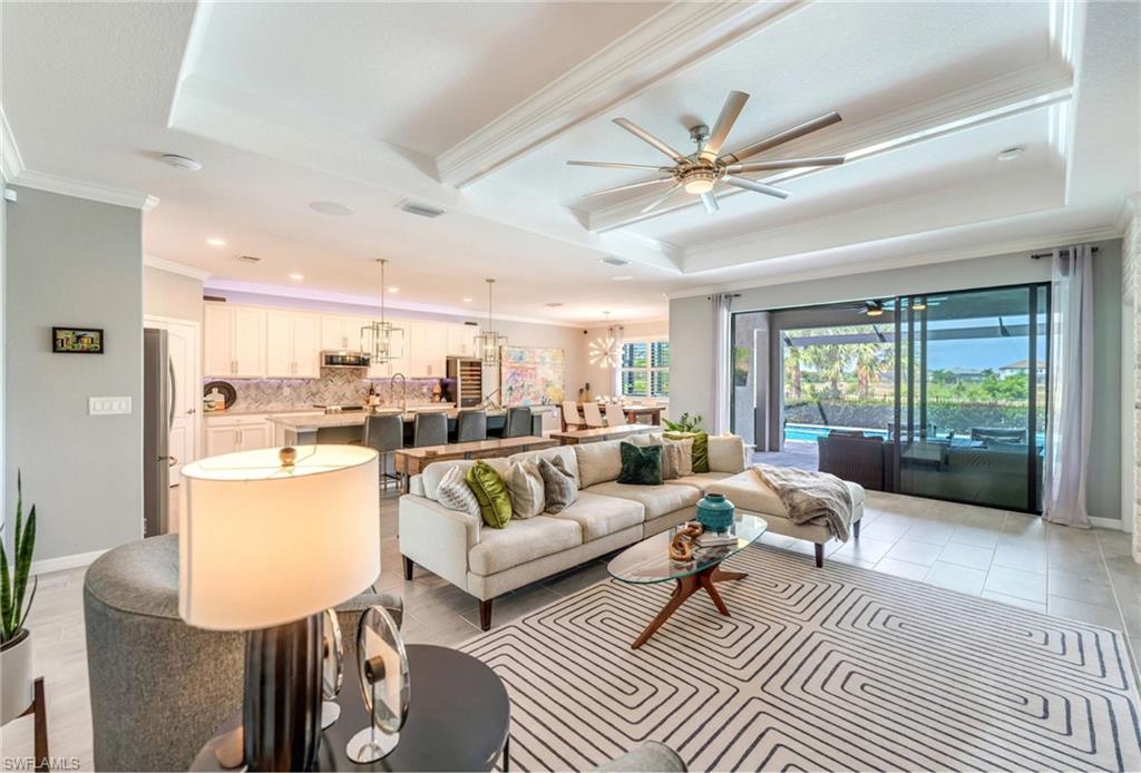 19812 Beechcrest Place Estero, FL 33928 - Photo 8 of 50 a living room with furniture and a large window