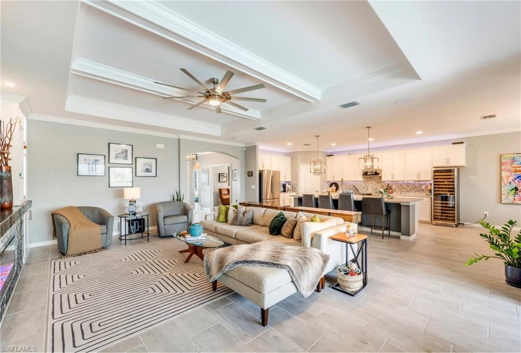 19812 Beechcrest Place Estero, FL 33928 - Photo 9 of 50 a living room with furniture and a chandelier