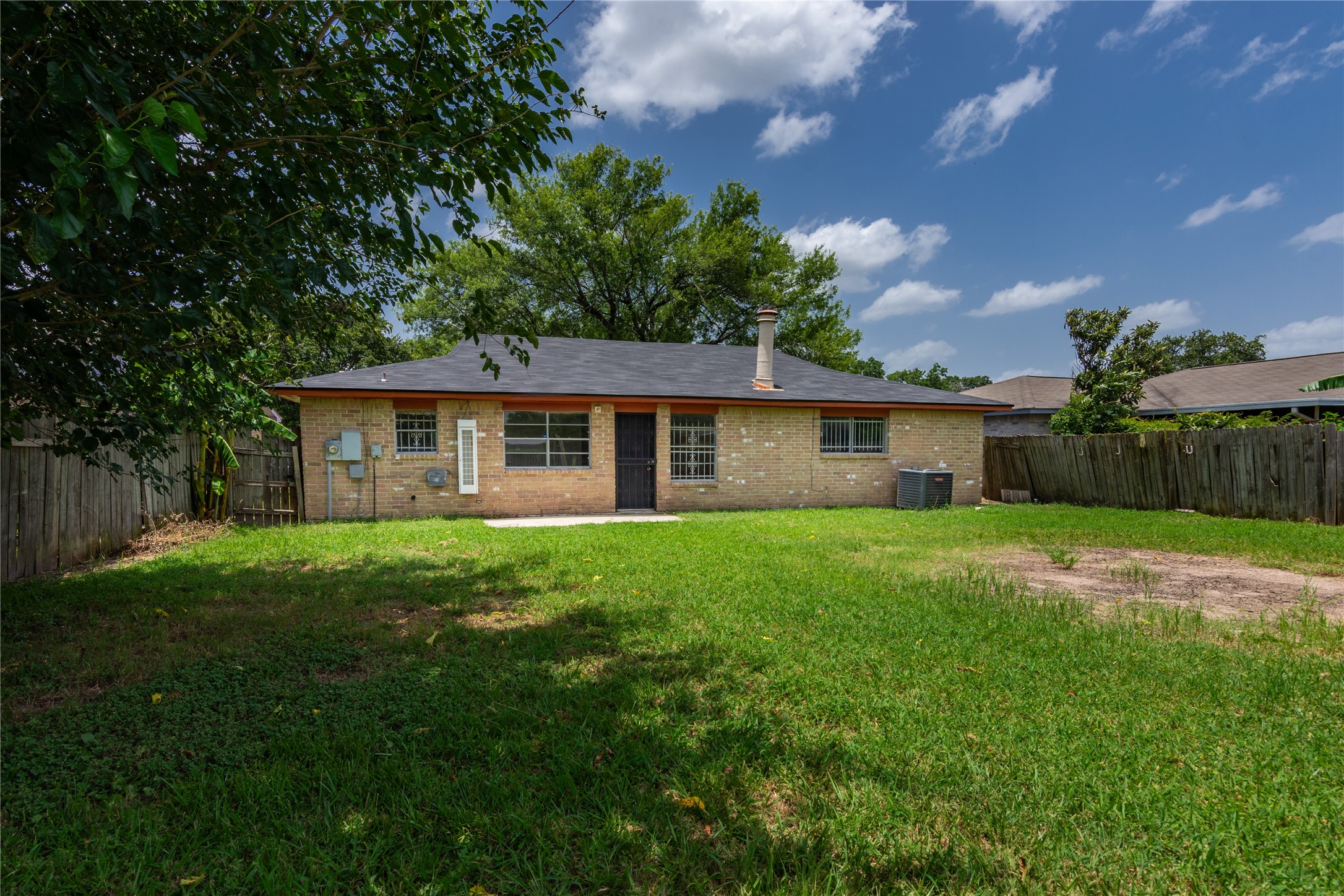 11710 Old Telegraph Road Houston, TX 77067 - Photo 23 of 24 Spacious backyard - ready for entertainment and relaxation!