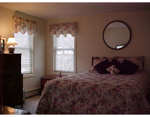 164 Marion Road Middleboro, MA 02346 - Photo 15 of 24 a bedroom with a bed and a window
