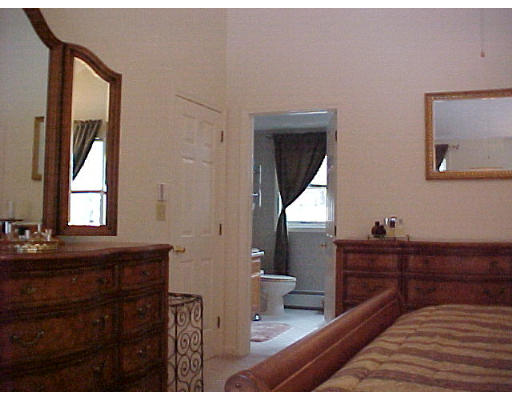164 Marion Road Middleboro, MA 02346 - Photo 17 of 24 a bedroom with a bed and a dresser