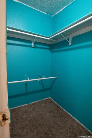 a bathroom with a bathtub shower sink vanity and toilet