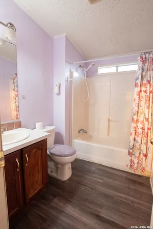 a view of yard with swimming pool and trees