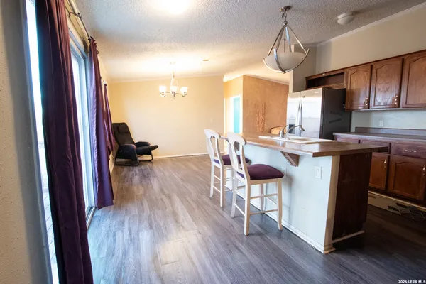 a view of a storage and utility room with washer and dryer