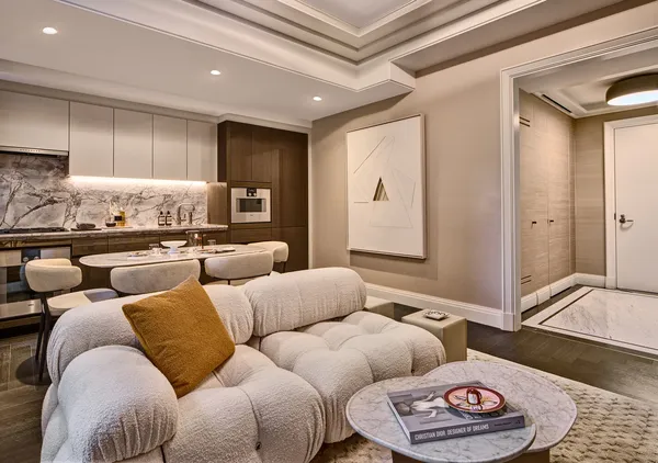 a living room with furniture and a rug