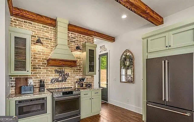 a view of a livingroom with furniture window and wooden floor