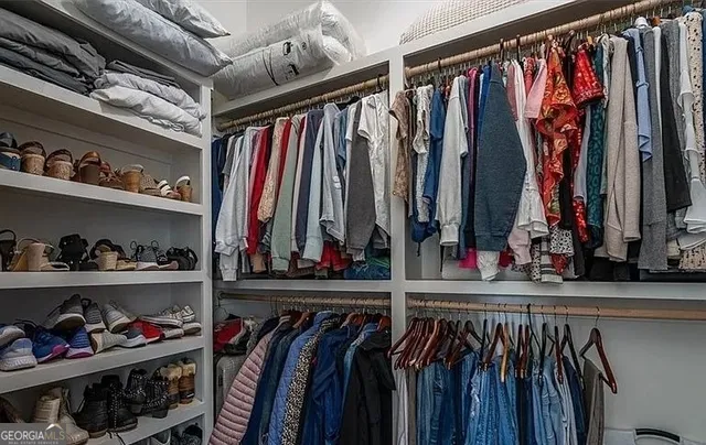 a view of a house with wooden fence
