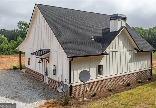 a living room with fireplace furniture and a flat screen tv