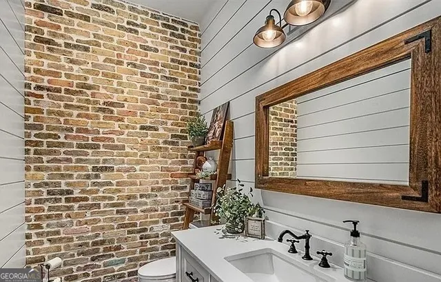 a kitchen with stainless steel appliances granite countertop a stove and a refrigerator
