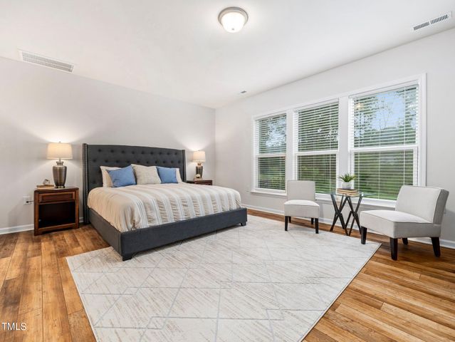 a bathroom with a granite countertop double vanity sink mirror and
