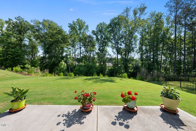an aerial view of multiple houses with yard
